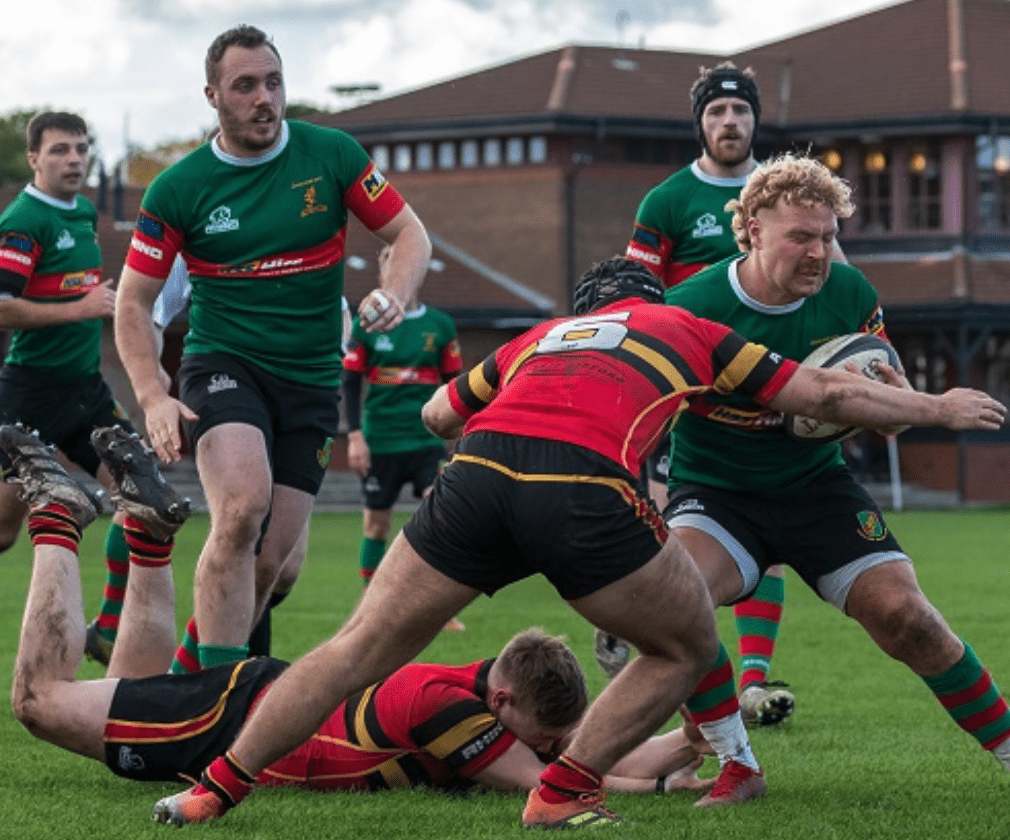 Seumas Ross carries the ball into contact watched by Gordon Gregor and Magnus Henry. Stewart's Melville v Highland 15-10-23